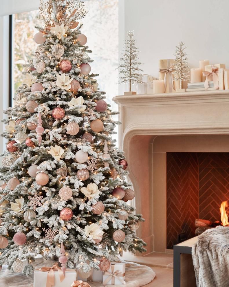 Holiday design expert Brad Schmidt decorated this wintry, whimsical Christmas tree in soft blush, gold and ivory ornaments from Balsam Hill. "The soft palate in the Winter Wishes Ornament Set not only looks great on the tree but as a centerpiece," he says. "Insert ornaments in clear cylinders or bowls of different sizes to add a beautiful interior accent. Battery-operated microlights are a fun way to brighten up the piece."