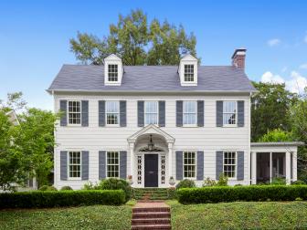 White Colonial Home With Gray Shutters and Front Door